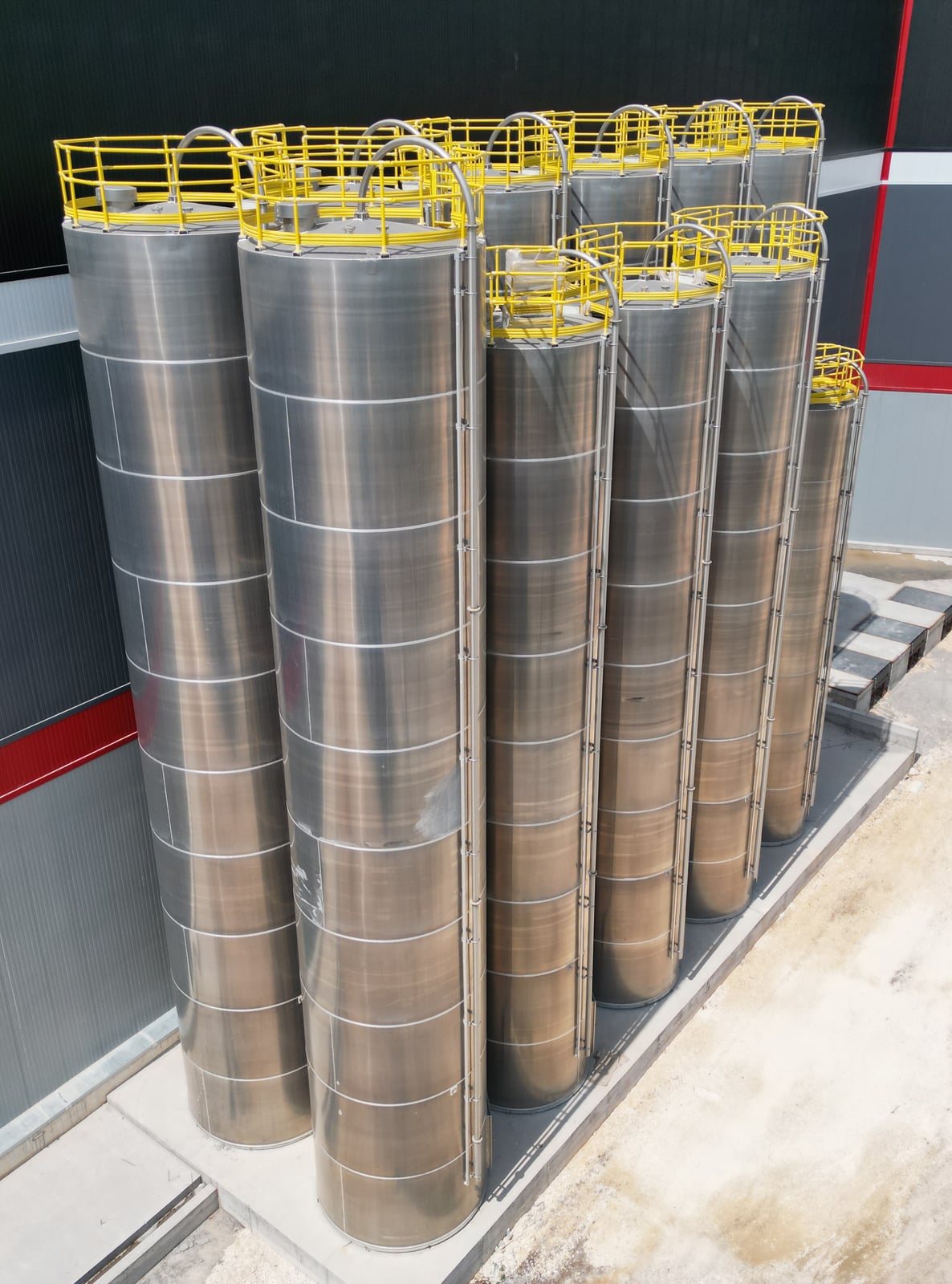 Aerial view of the 11+4 aluminium silo group installed for the central raw-material system
